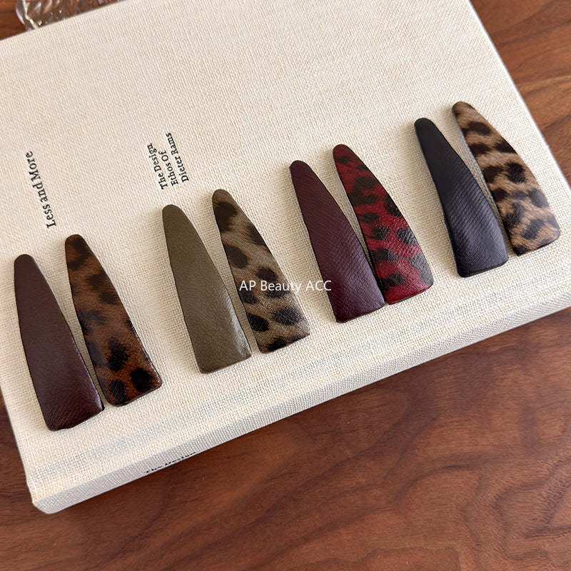 E관 - 호피 가죽 삼각형 헤어핀 [27489] 25.09-4