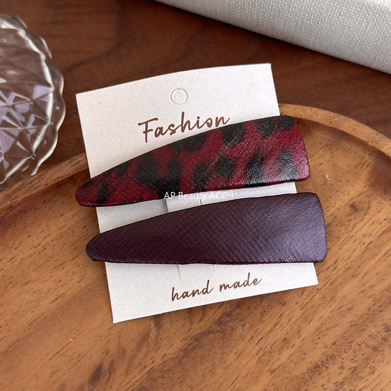 E관 - 호피 가죽 삼각형 헤어핀 [27489] 25.09-4