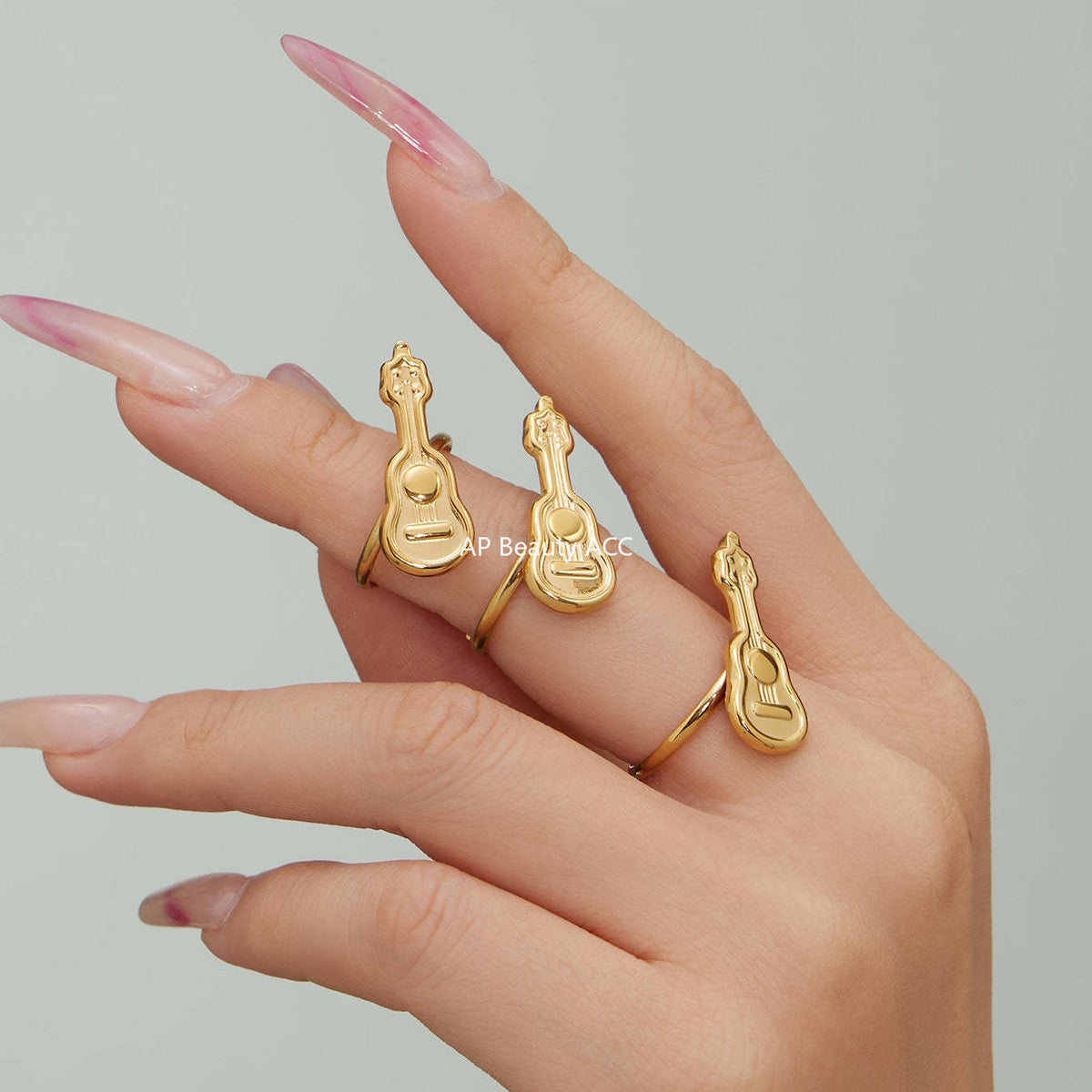 D관 - 스테인리스 스틸 18K 도금 미니 기타 오픈형 반지 [A542] 25.12-3