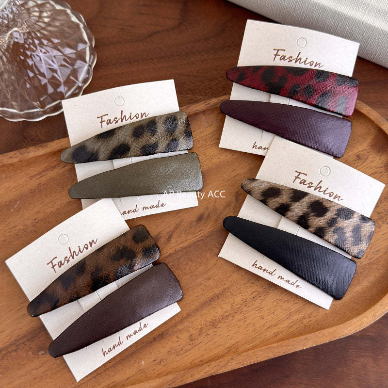 E관 - 호피 가죽 삼각형 헤어핀 [27489] 25.09-4