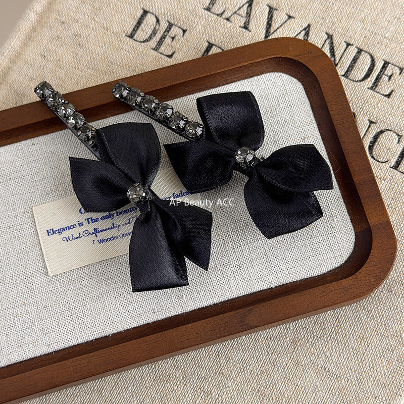 E관 - 리본 디자인 큐빅 장식 헤어핀 [26037E] 25.11-2