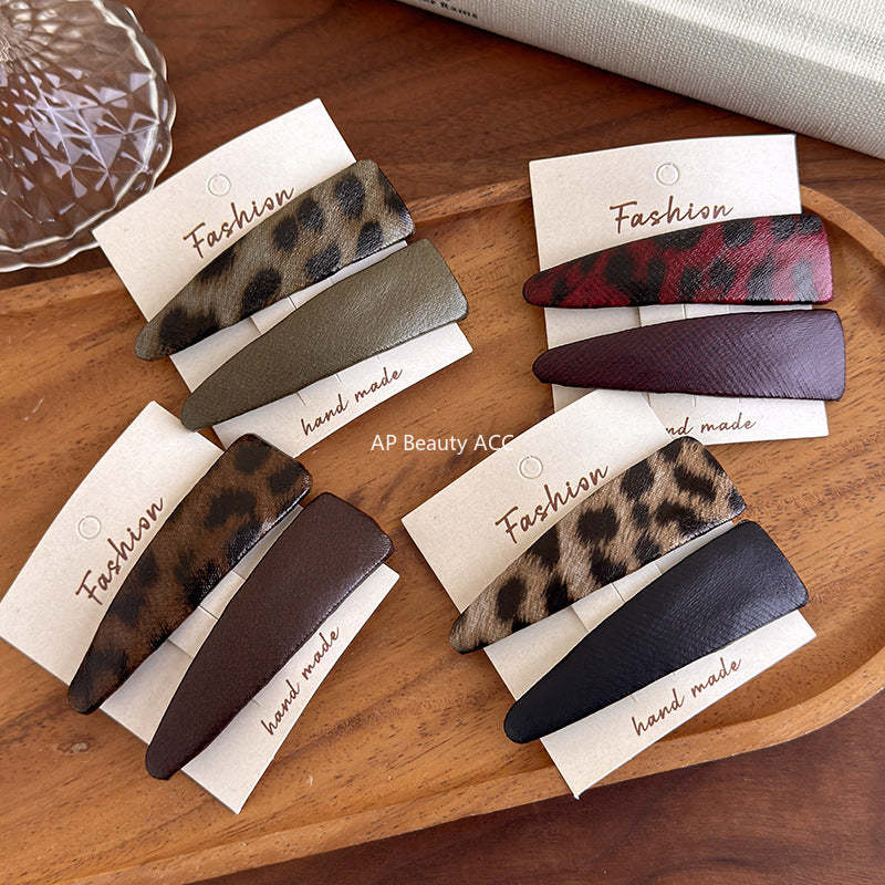 E관 - 호피 가죽 삼각형 헤어핀 [27489] 25.09-4