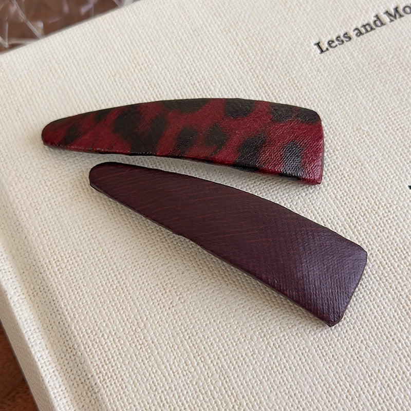 E관 - 호피 가죽 삼각형 헤어핀 [27489] 25.09-4