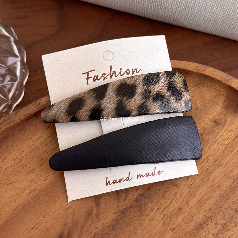 E관 - 호피 가죽 삼각형 헤어핀 [27489] 25.09-4