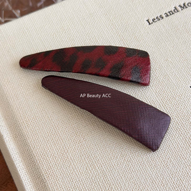 E관 - 호피 가죽 삼각형 헤어핀 [27489] 25.09-4